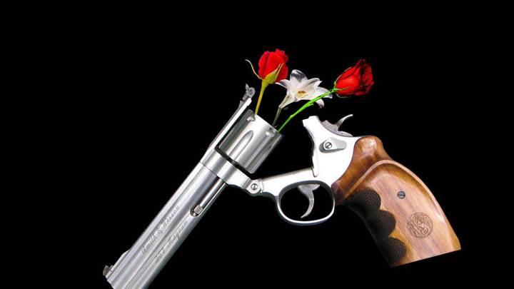 Guns And Roses On Black Background